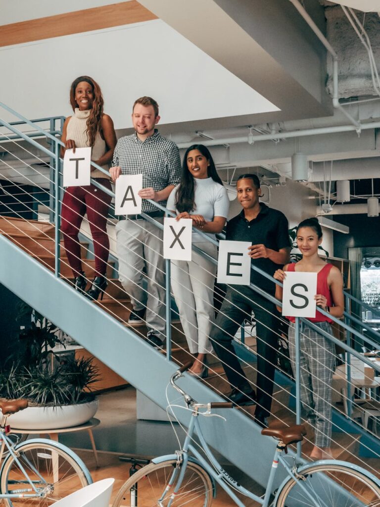 happy coworkers standing on a stairway 